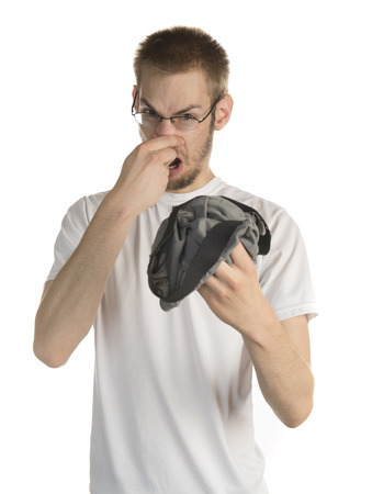 34557175-young-white-male-in-his-20s-holding-smelly-underwear.jpg