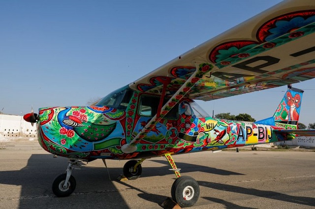 A two-seater Cessna aircraft painted with Pakistani truck art is seen at general aviation area at Jinnah International Airport in Karachi, Pakistan, December 30, 2020. PHOTO: REUTERS