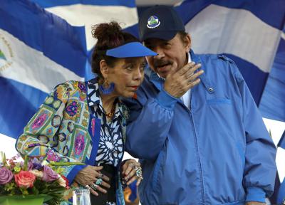 FILE - In this Sept. 5, 2018 file photo, Nicaragua's President Daniel Ortega and his wife and Vice President Rosario Murillo, lead a rally in Managua, Nicaragua. Nicaragua’s Sandinista-controlled congress has cancelled nearly 200 nongovernmental organizations this last week of May 2022, ranging from a local equestrian center to the 94-year-old Nicaraguan Academy of Letters, in what critics say is President Daniel Ortega’s attempt to eliminate the country’s civil society. (AP Photo/Alfredo Zuniga, File)